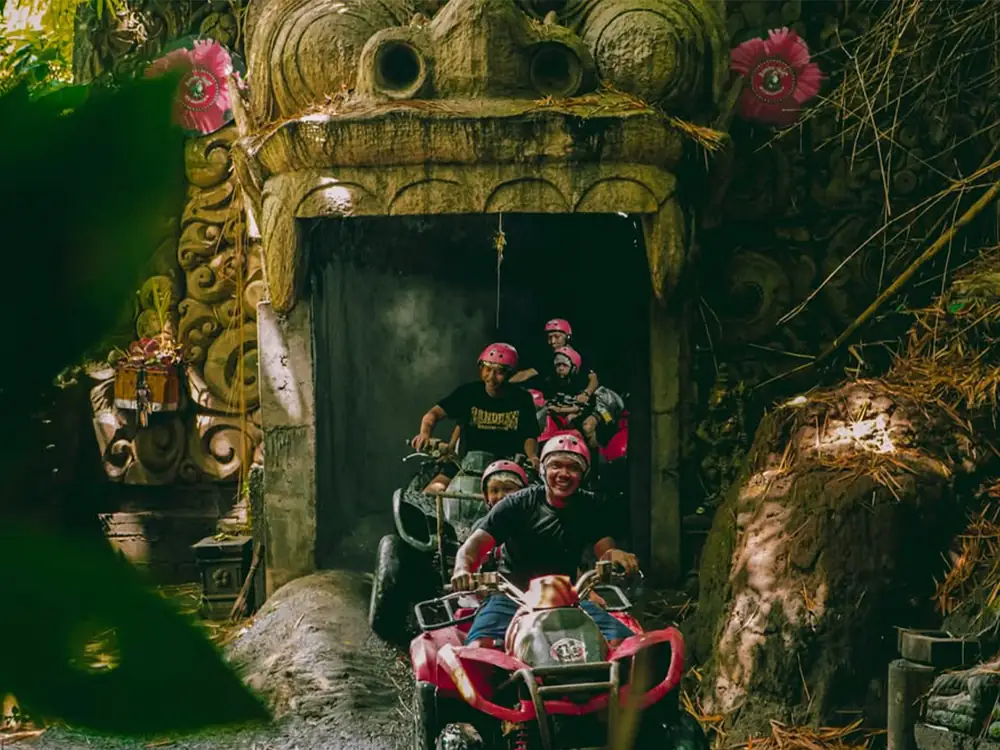 An ATV riding into the mouth of the Barong Cave tunnel at Sukawati