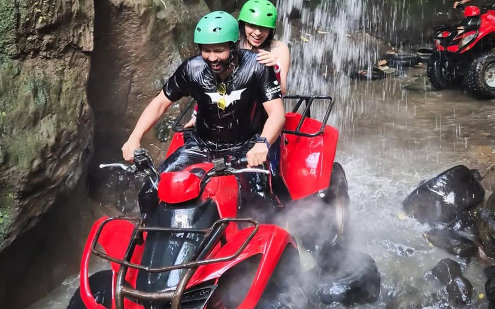 Feel the ultimate thrill of splashing through refreshing waterfall streams on a tandem ATV ride with your partner.